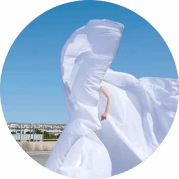 round cutout of person with white big flying suit image for page news media newsletter